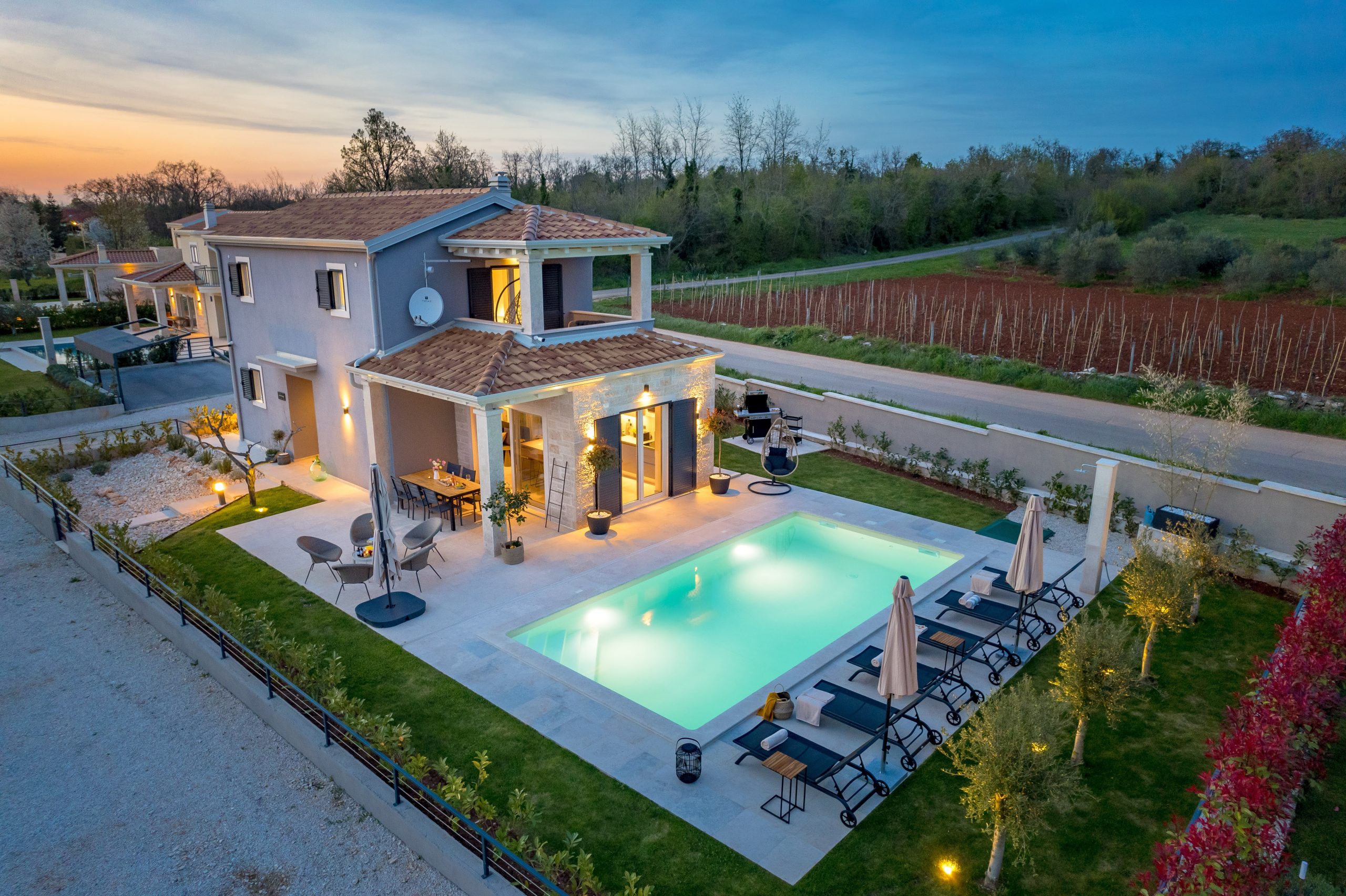 Aerial dusk view of the pool and barbecue terrace