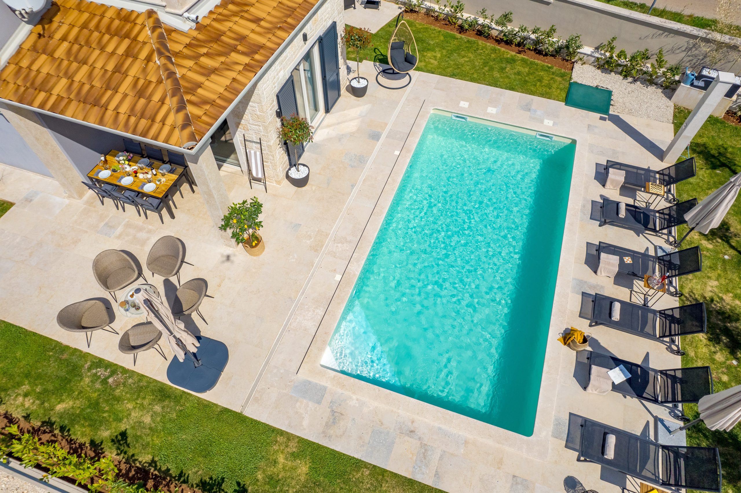 Aerial panorama of the pool and olive tree garden