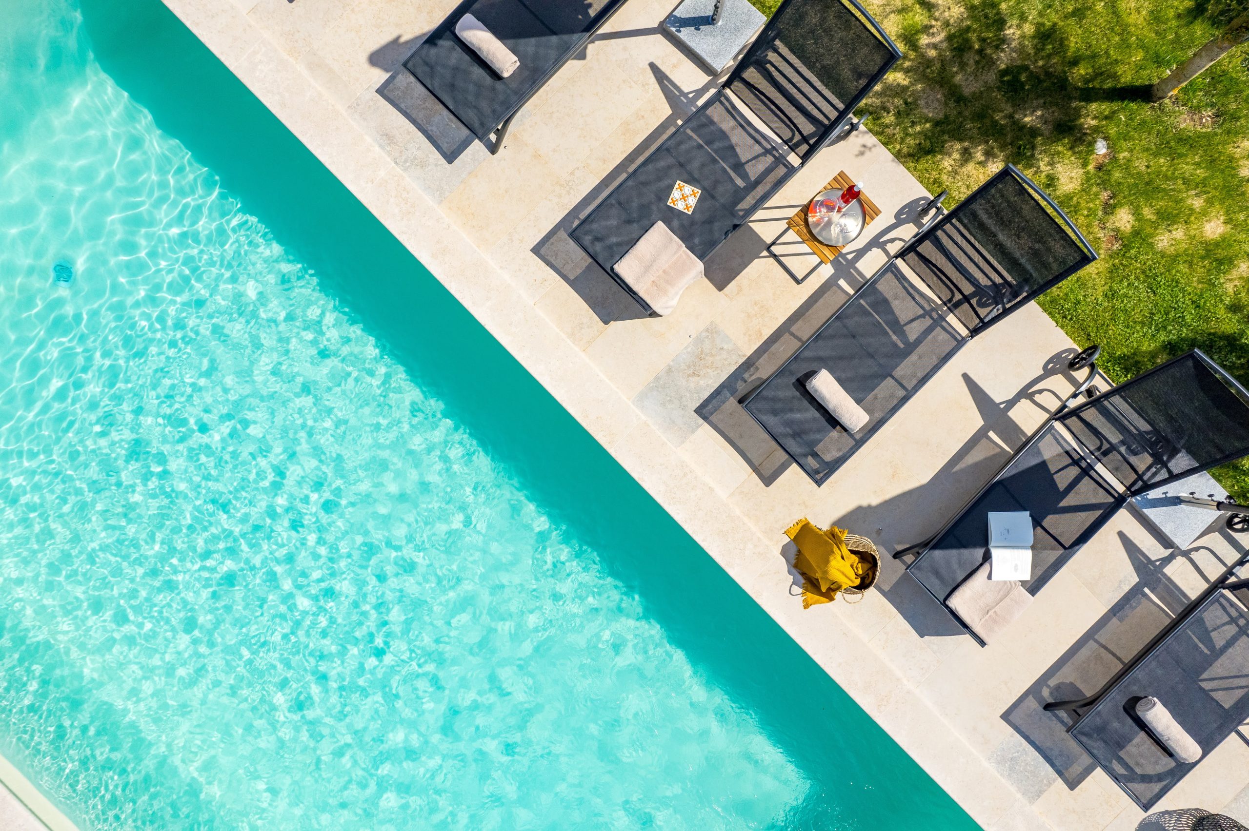 Aerial view of the pool and sun loungers from above
