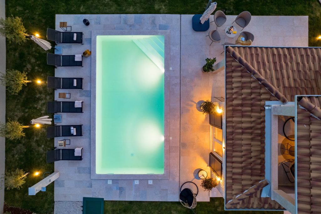 Aerial night view of the pool and lounge terrace