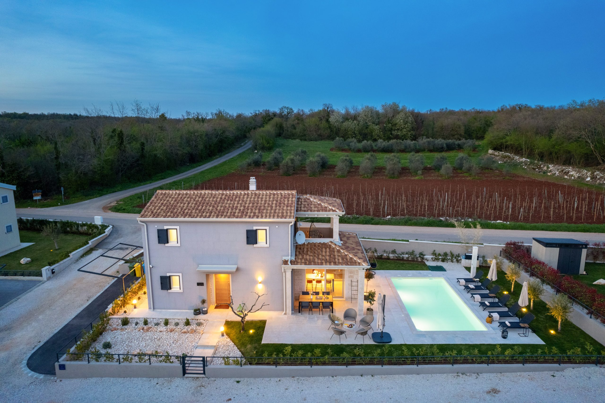 Aerial twilight view of the villa and surrounding vineyards