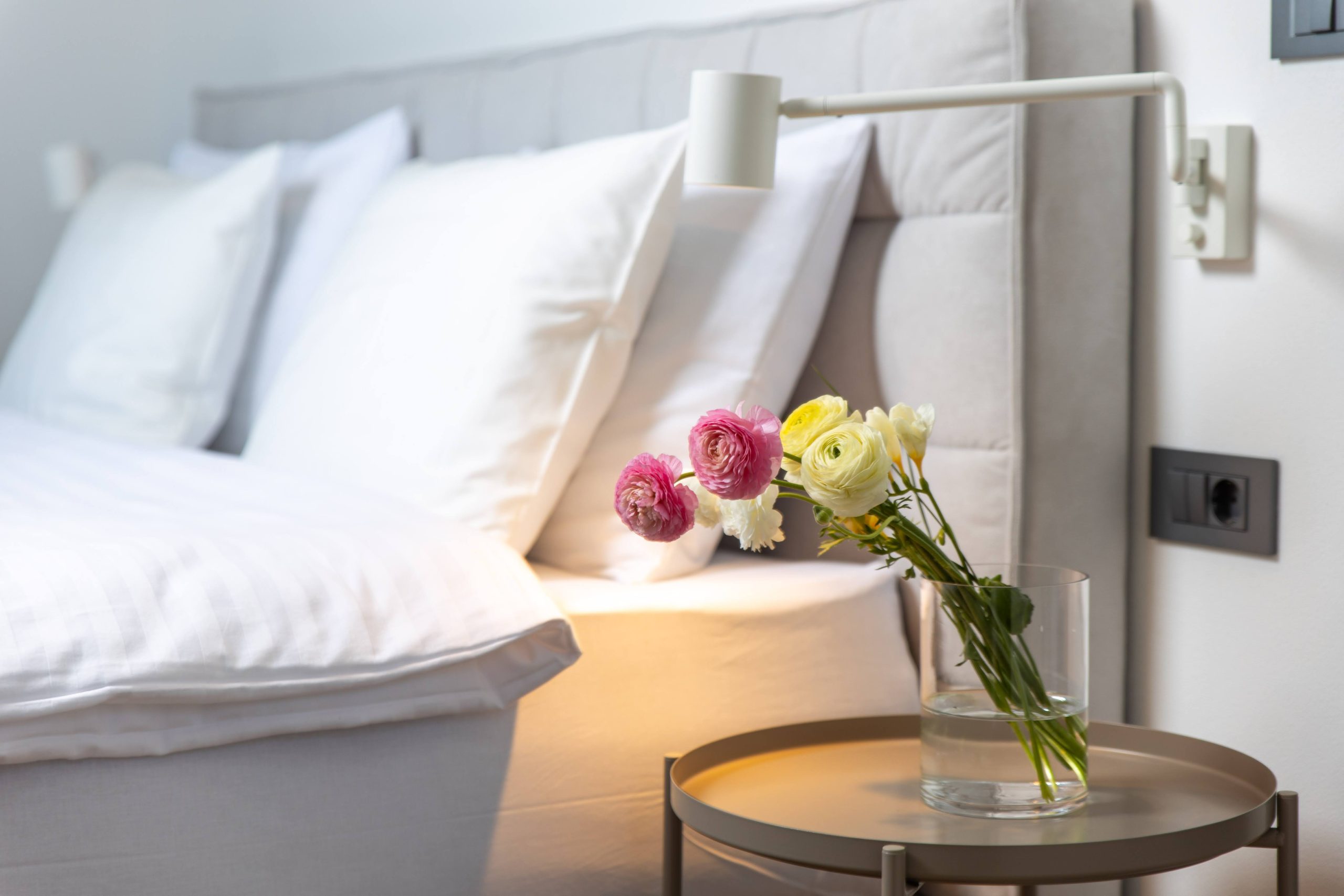 Fresh flowers on the bedroom nightstand