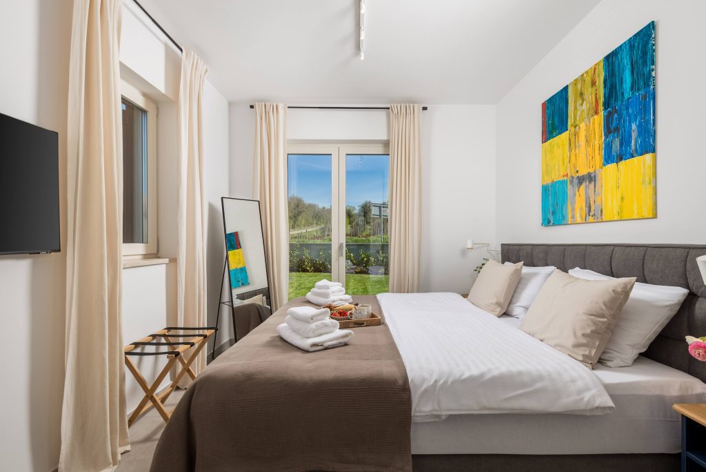 Bedroom with door opening onto the garden terrace