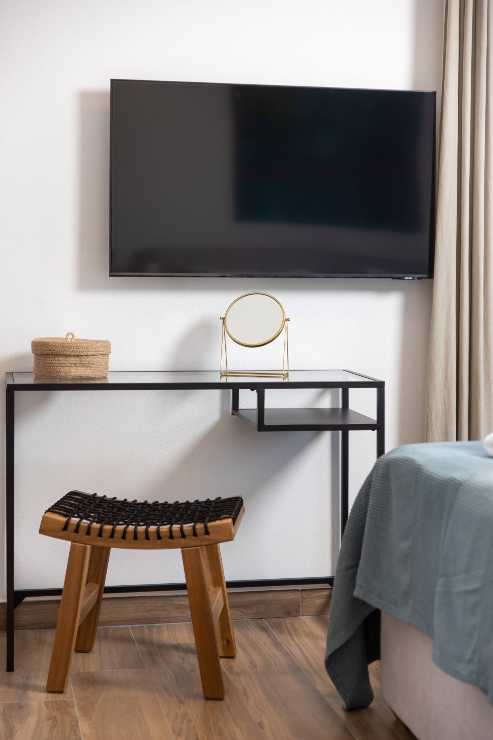 Bedroom with flat-screen TV and console table