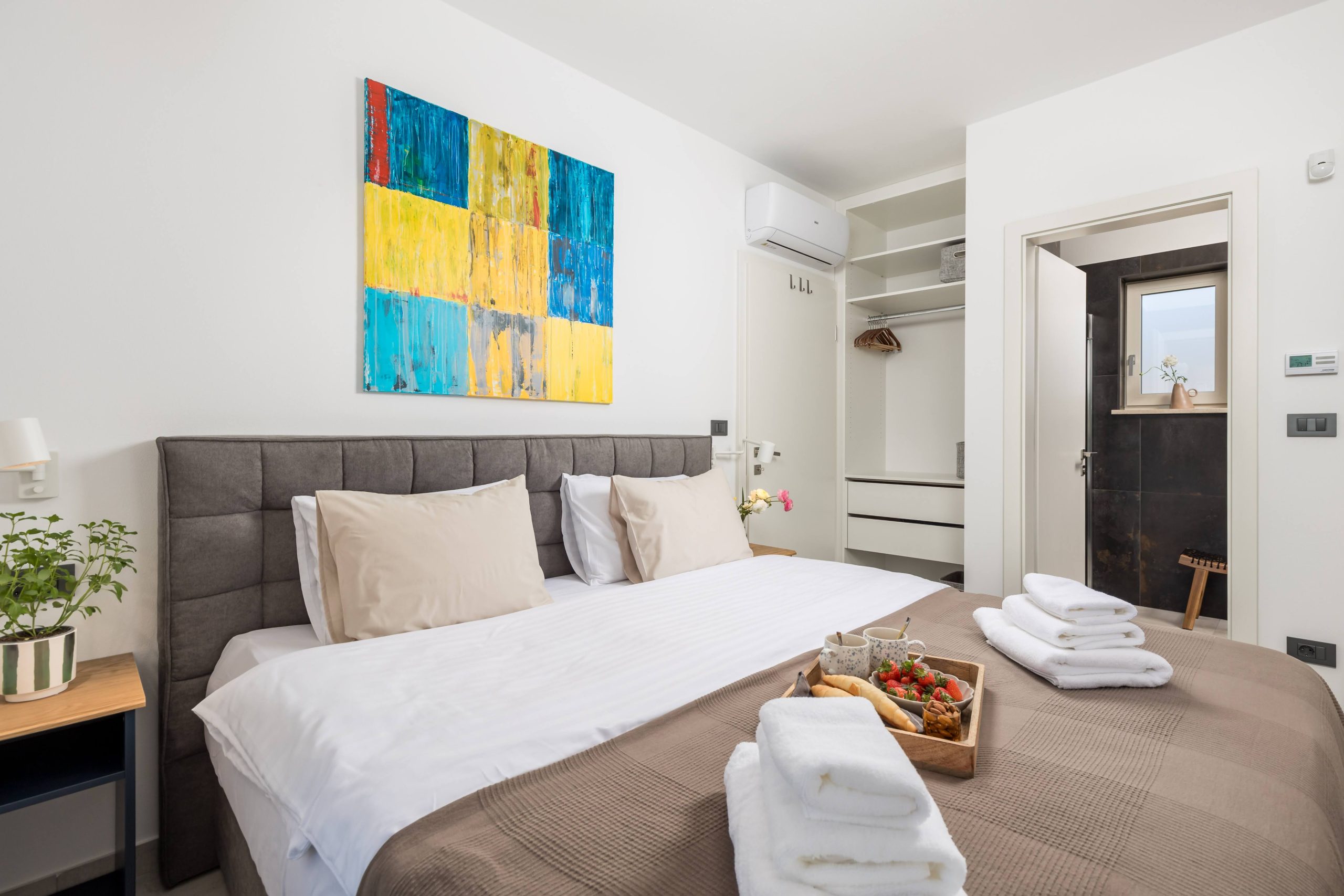 Bedroom with king-size bed and walk-in wardrobe