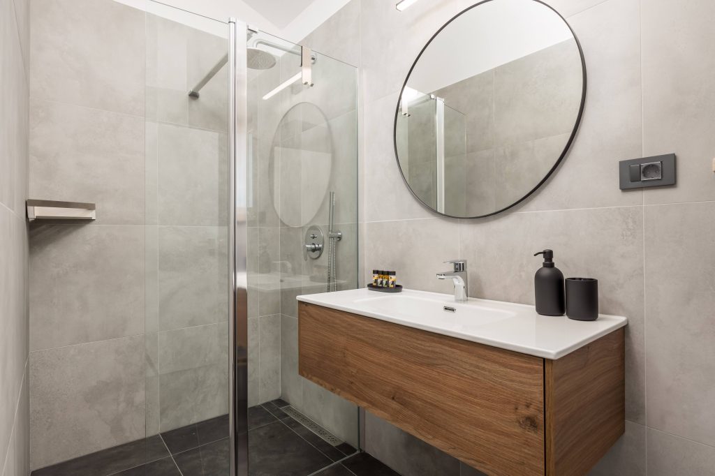 Ensuite bathroom with glass shower and wooden vanity