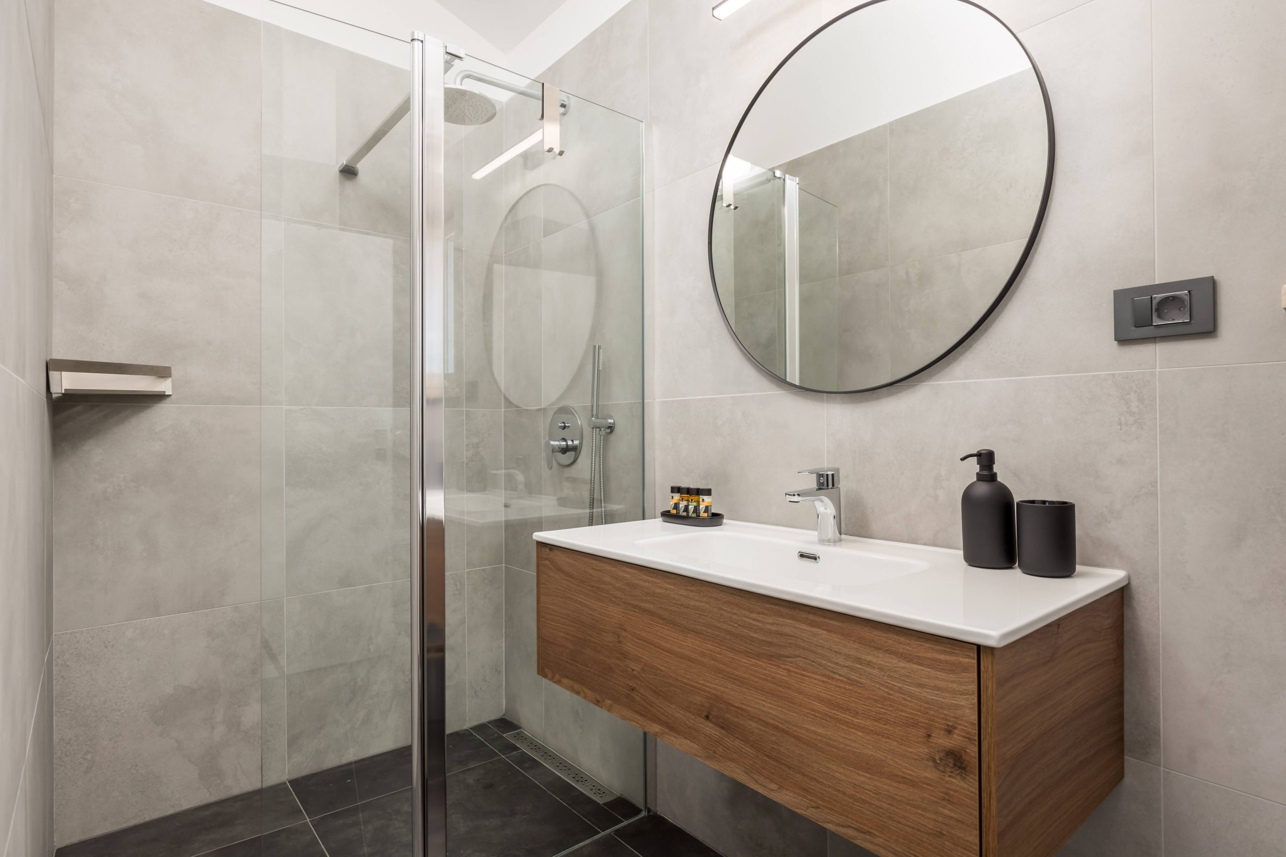 Ensuite bathroom with glass shower and wooden vanity