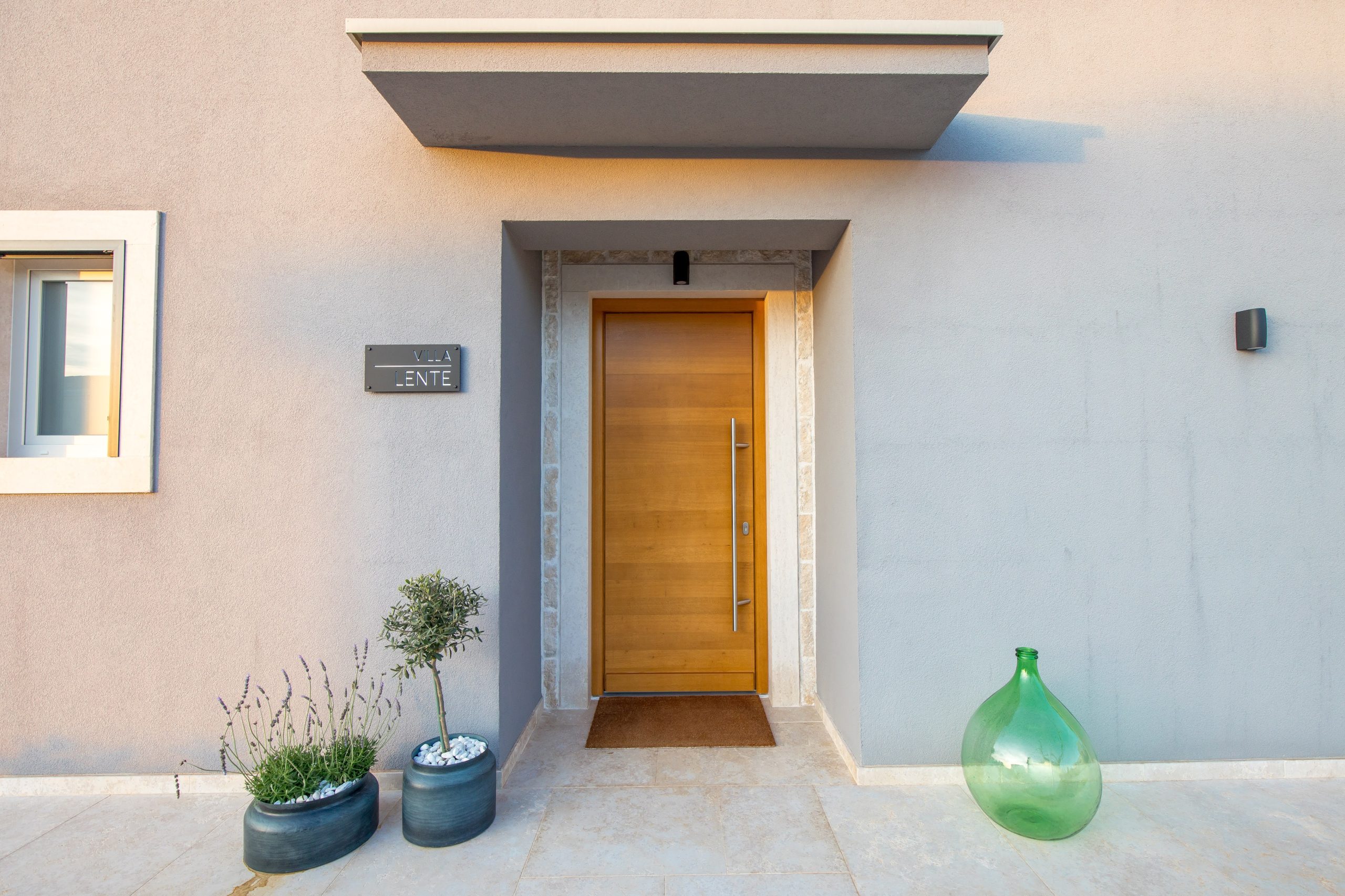 Front door with the Villa Lente name sign
