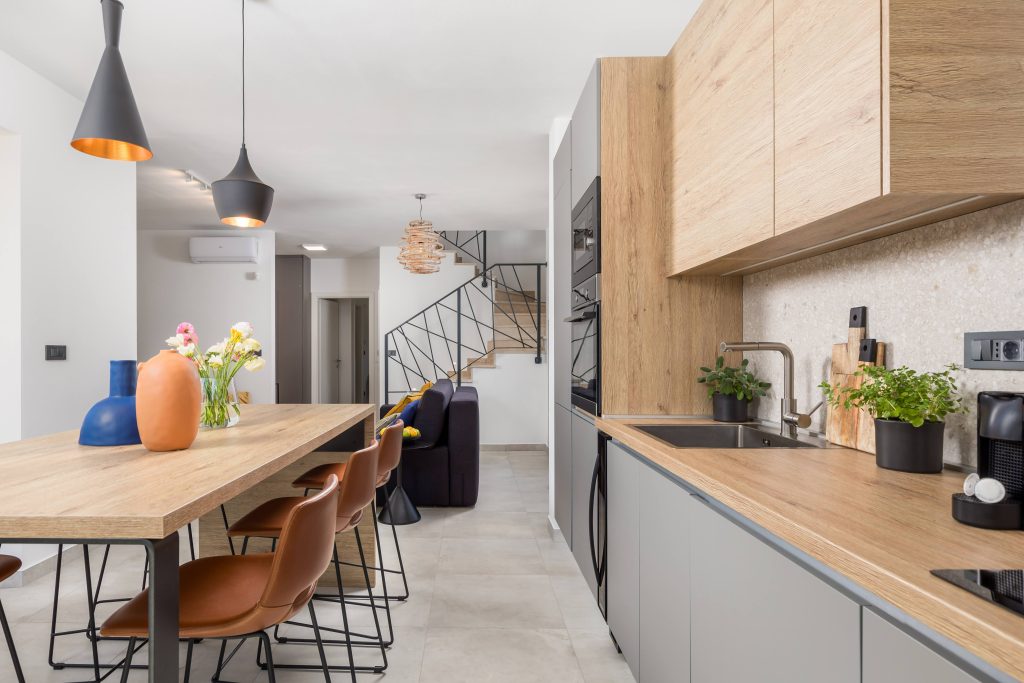 Open-plan kitchen with staircase and living room view