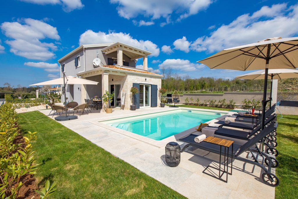 Private pool framed by the olive tree garden