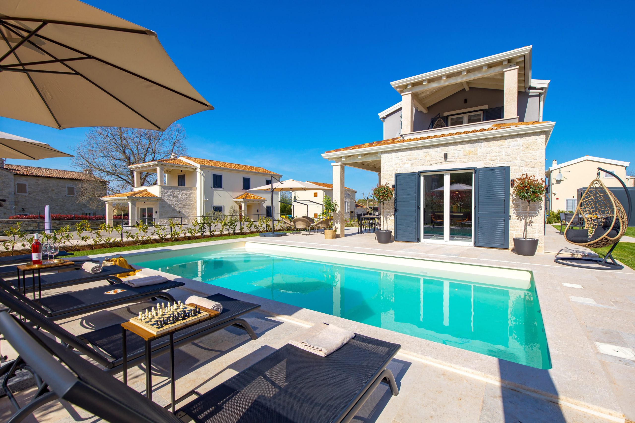 Panoramic view of the private pool and villa property
