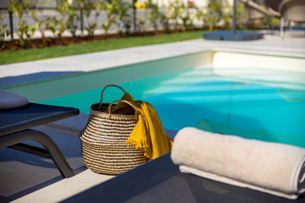 Beach basket and scarf by the private pool