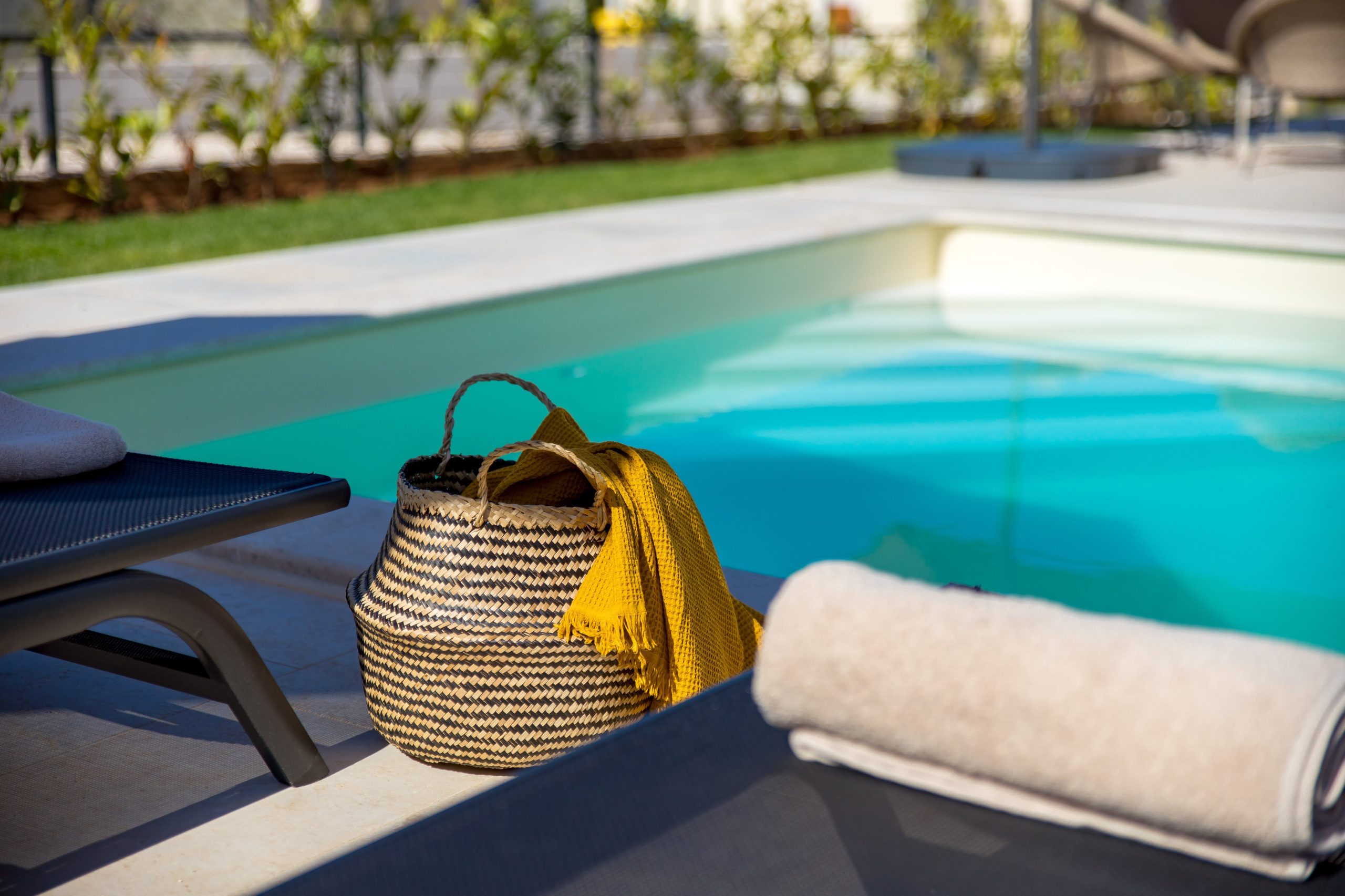 Beach basket and scarf by the private pool